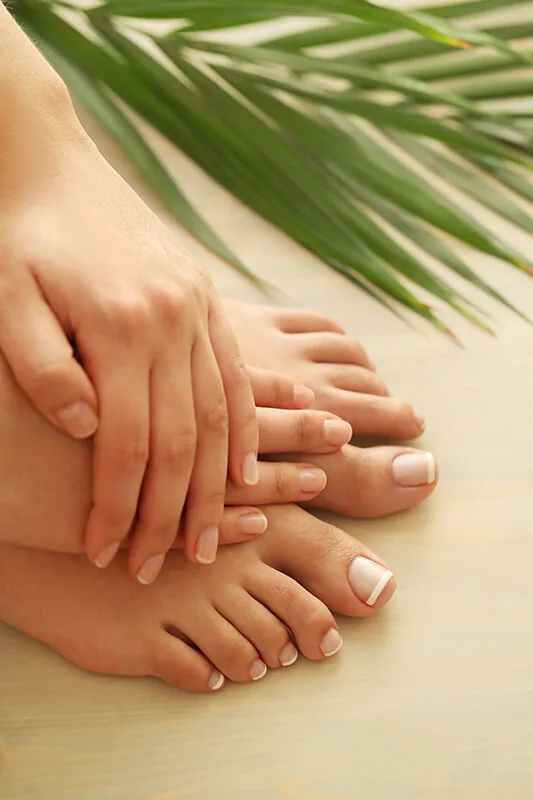 Well-cared-for hands and feet with clean, healthy-looking nails